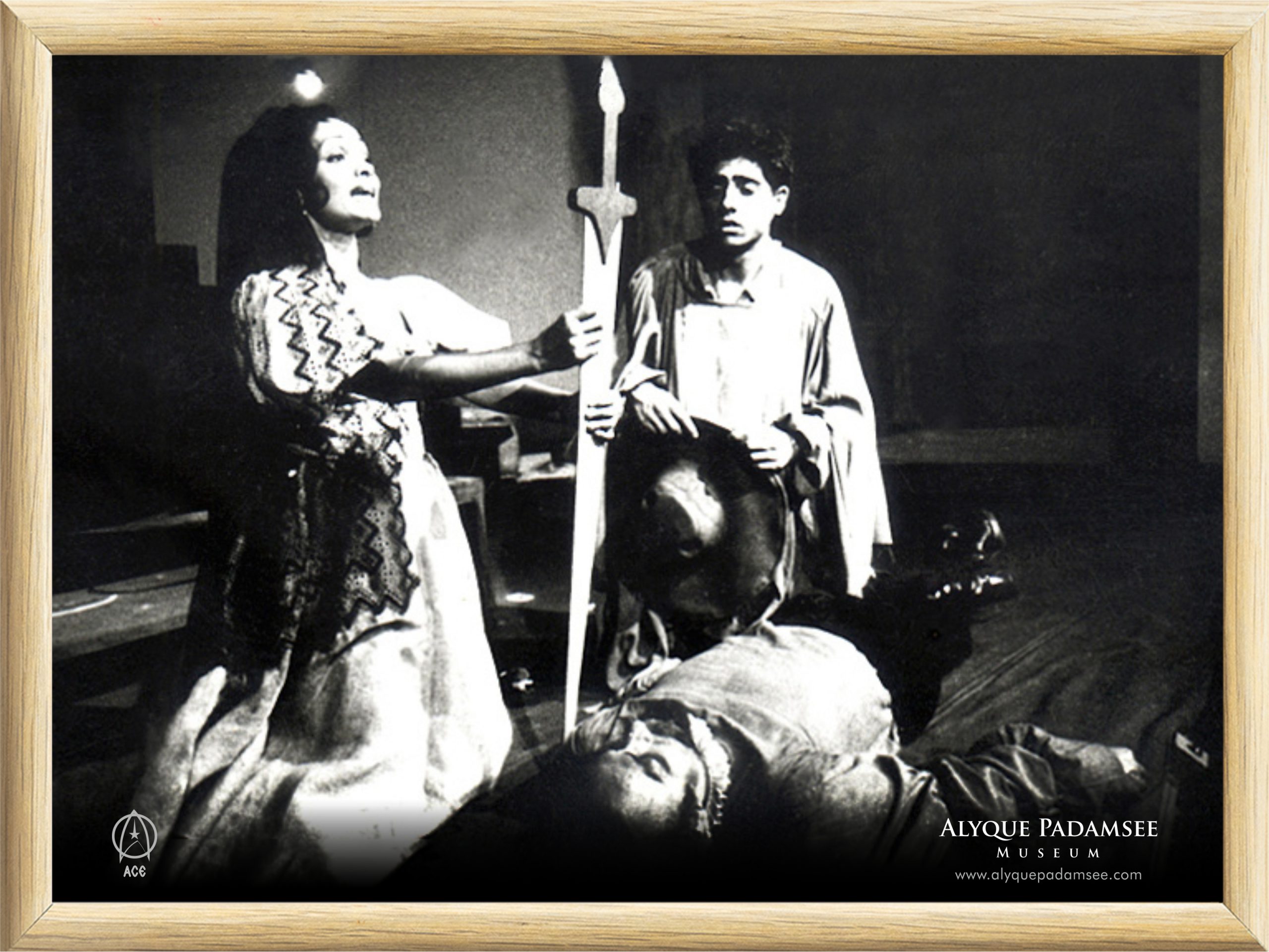 The last scene, where Don Quixote is lying dead. Aldonza and Sancho are sitting beside him, as Aldonza takes the sword and bears respect.